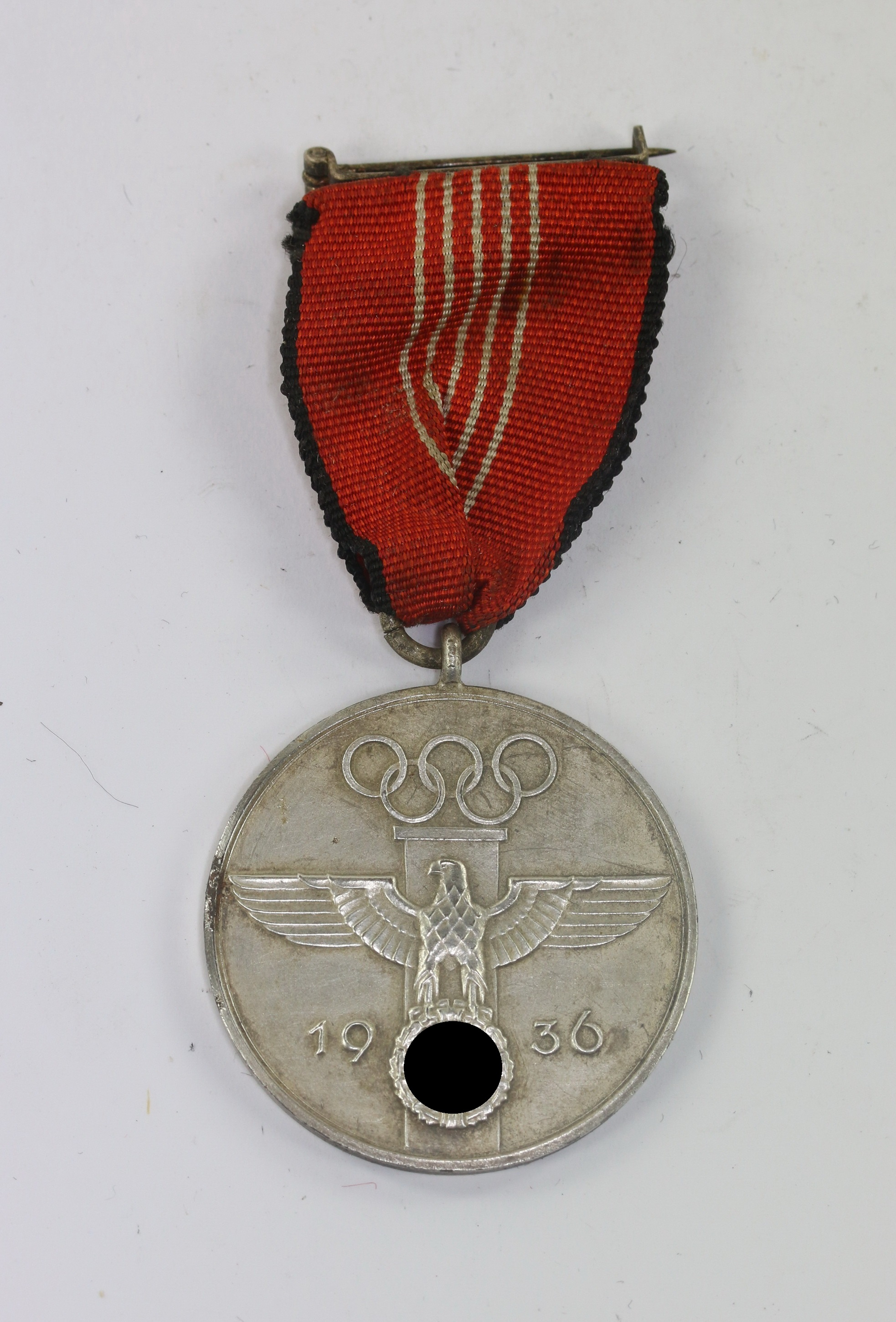 _deutsche_olympia_erinnerungsmedaille_1936_f_r_verdienstvolle_mitarbeit_bei_den_olympischen_spielen_1936_eisen_1__1 German Olympic Games Medal 1936. – Bild 1